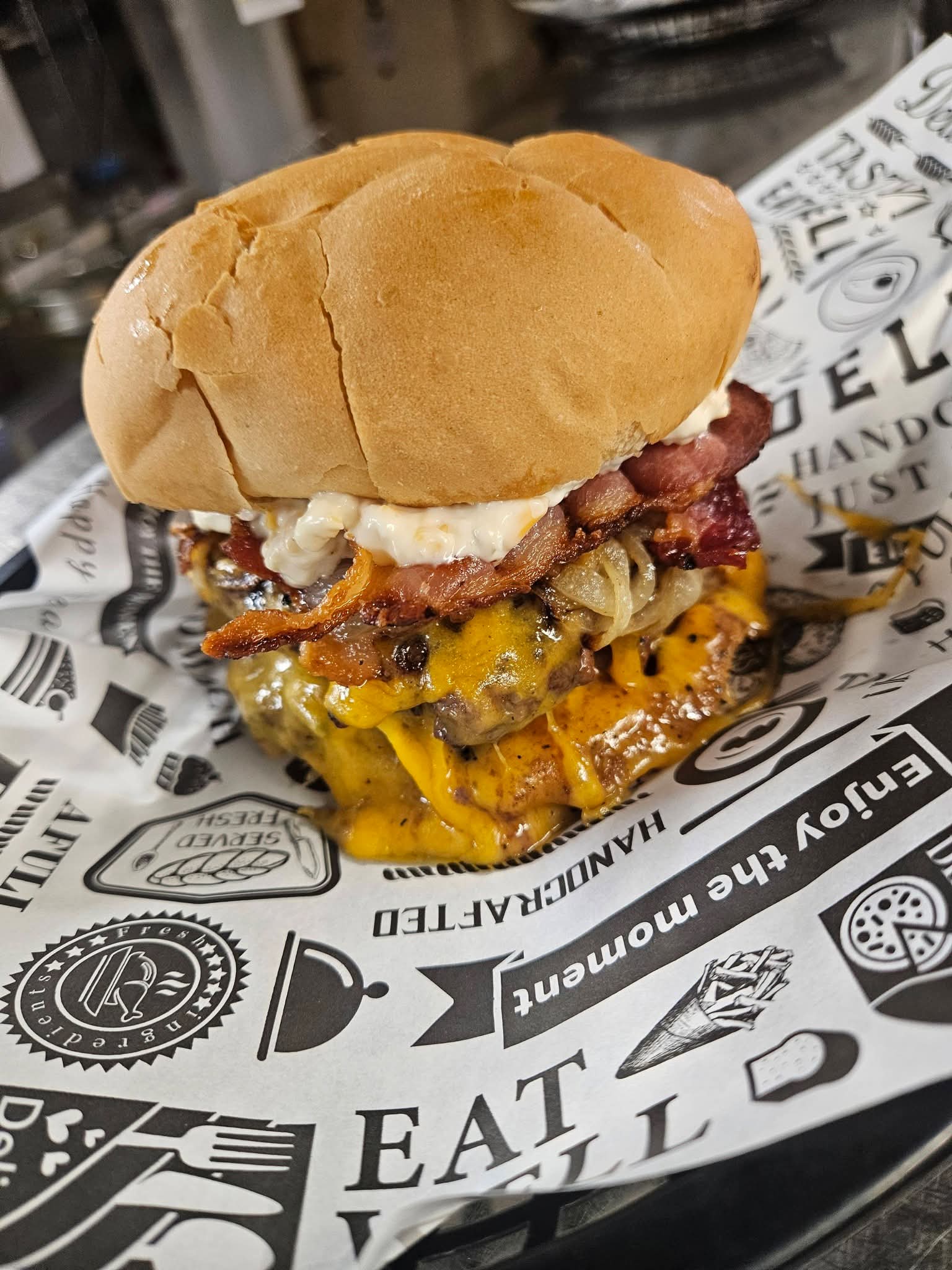 Bacon cheeseburger with melted cheddar and grilled onions