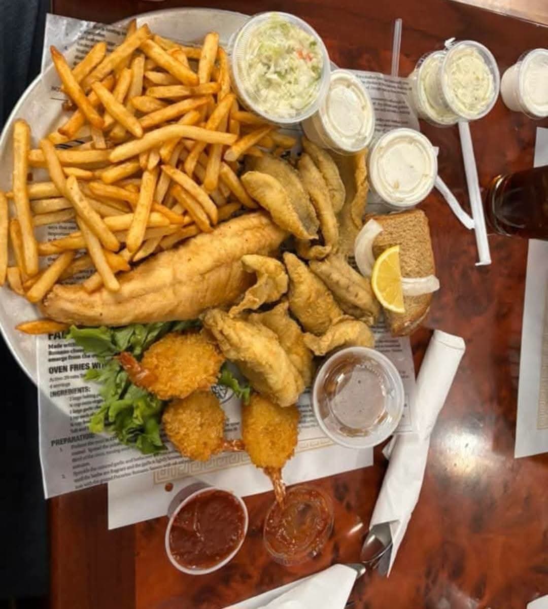 Friday fish fry combination platter with fries, coleslaw, and rye bread